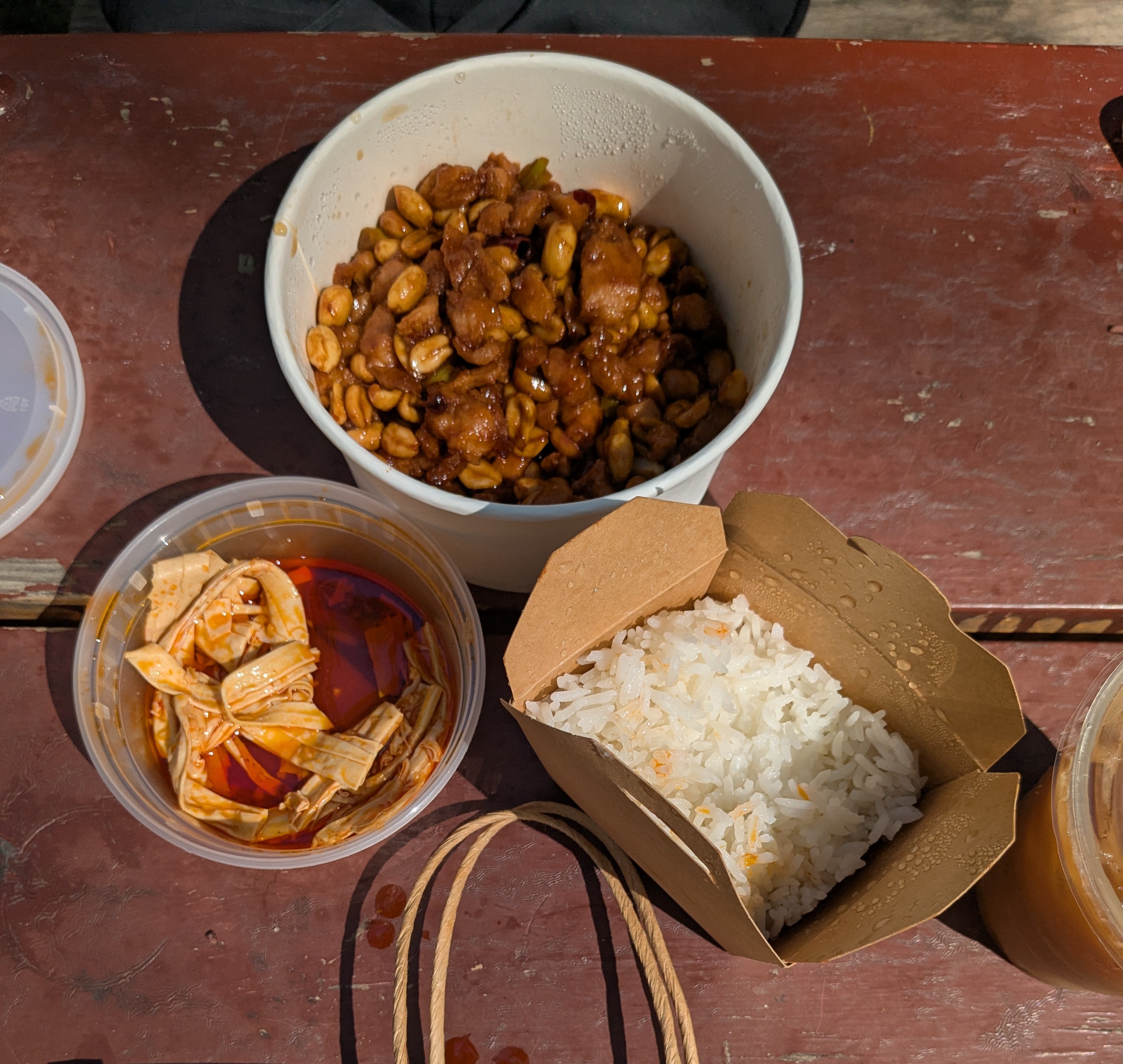 Kung pao chicken, tofu skin in chili oil, and white rice from Breeze