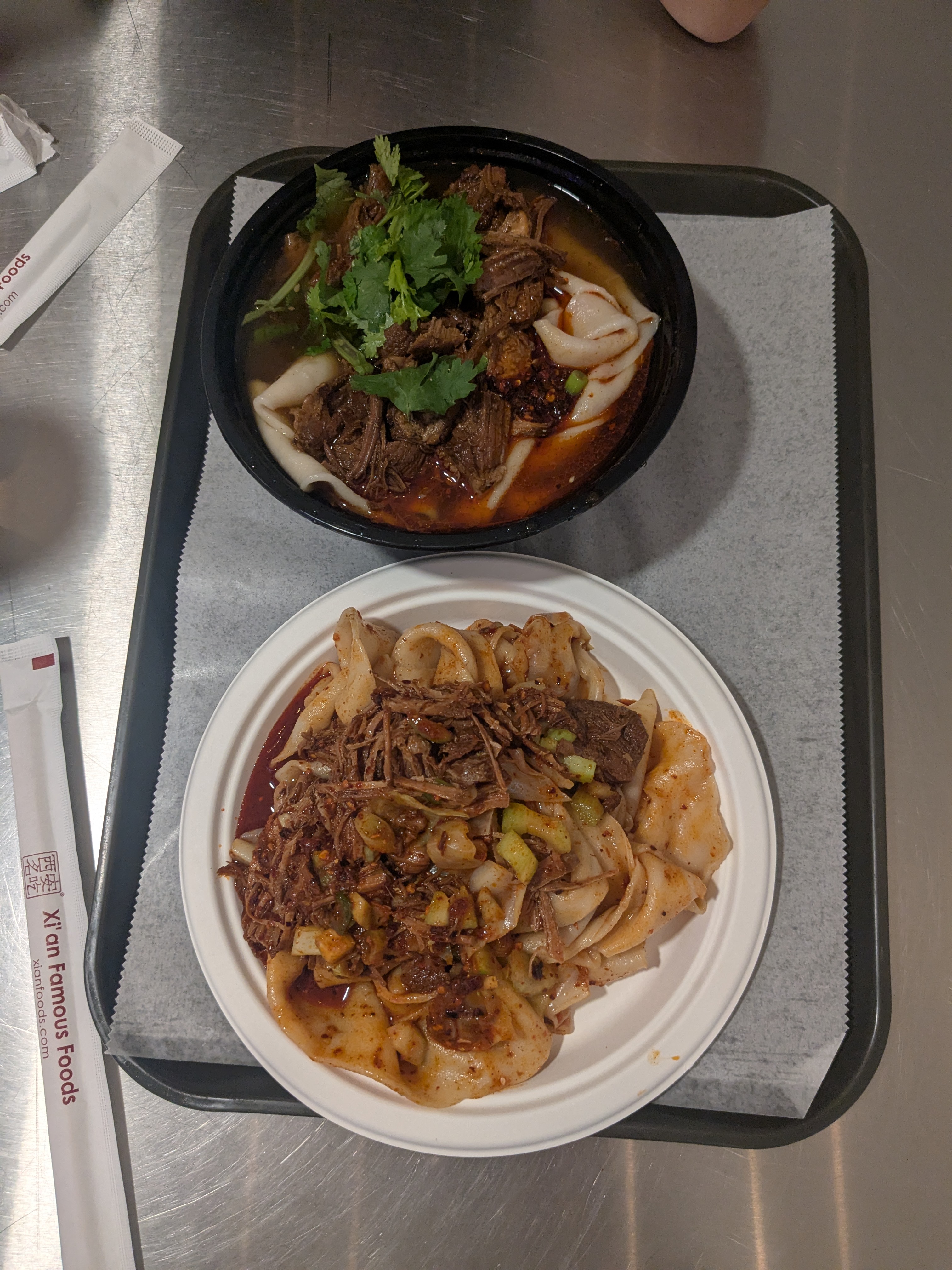 XFF food. Noodles with stewed pork, one dry, one in soup.